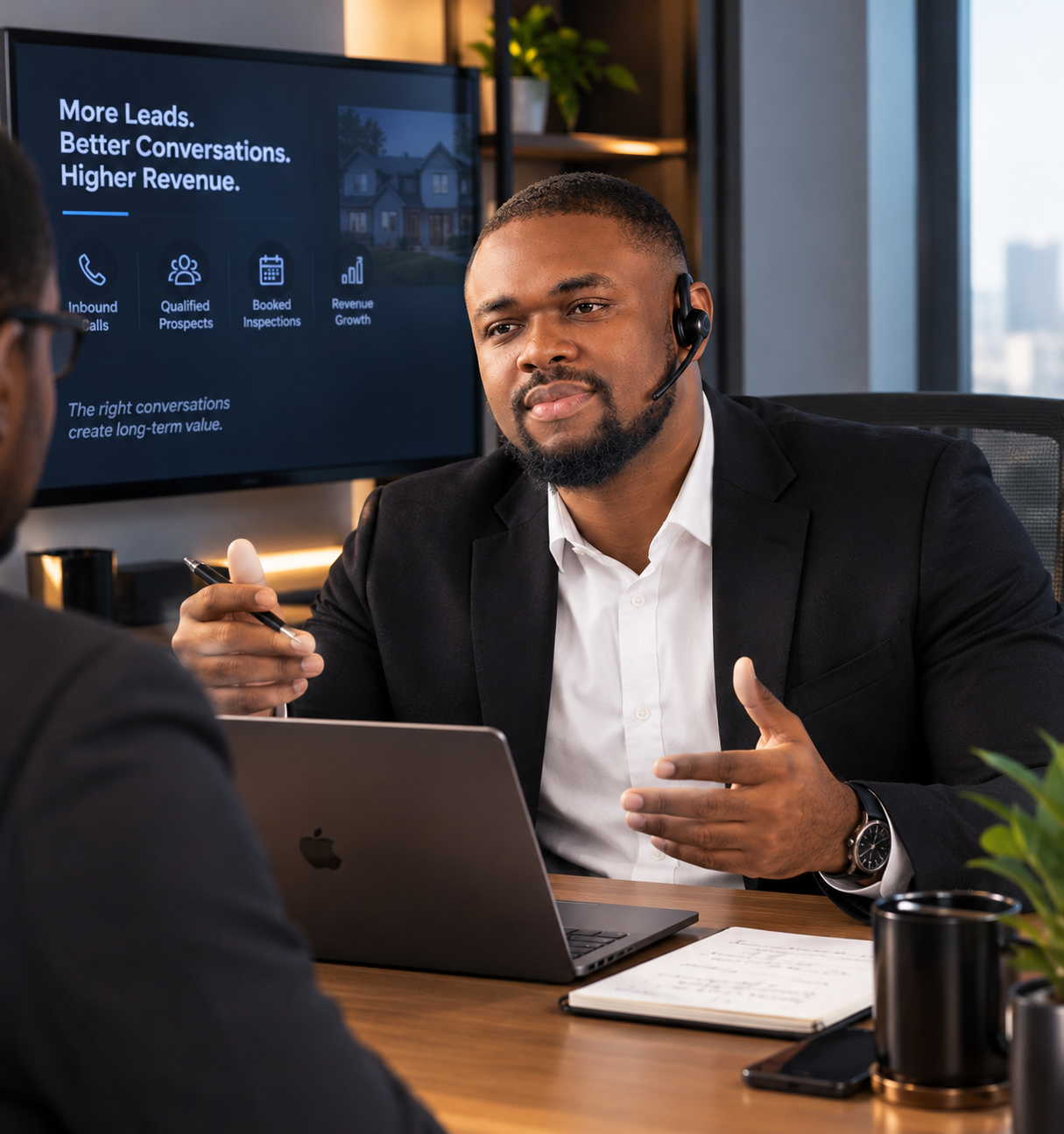 Patrick Ogbekhilu in a sales consultation in a modern office